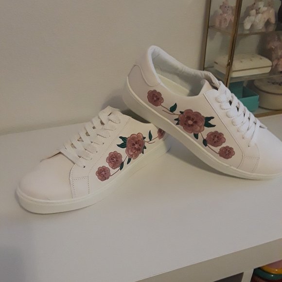 white embroidered shoes